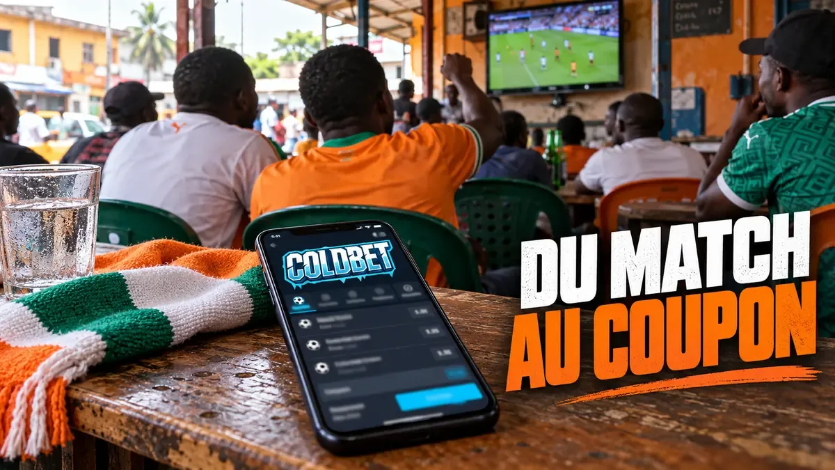 Smartphone avec un coupon Coldbet sur une table de maquis pendant un match diffusé à l'écran